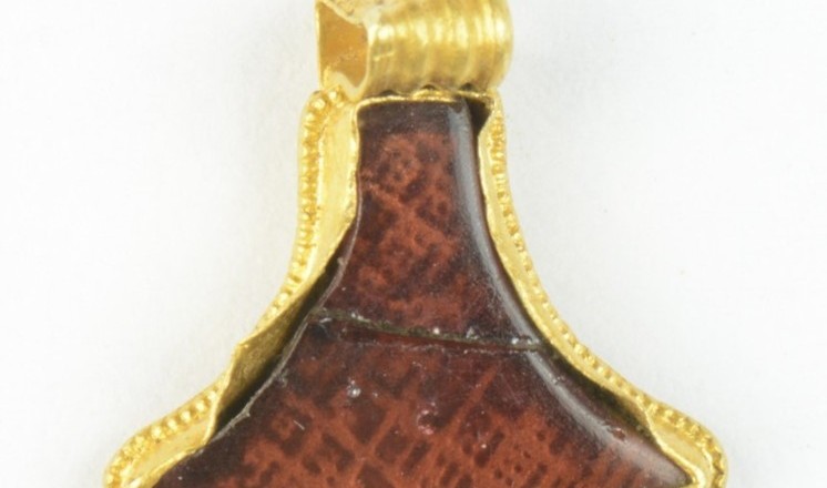 Early medieval gold and garnet pendant from near Horncastle, Lincolnshire.