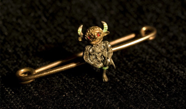 An original Usher imp brooch