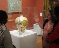 Collections Access Officer Dawn Heywood discussing a Grayson Perry pot with Freda and Jackline